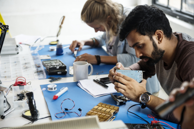 electronics technicians team working on computer parts